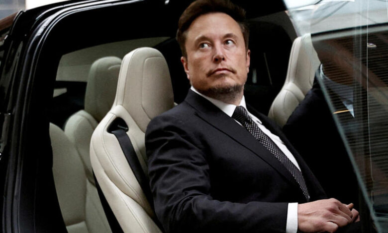 FILE PHOTO: Tesla Chief Executive Officer Elon Musk gets in a Tesla car as he leaves a hotel in Beijing, China May 31, 2023. REUTERS/Tingshu Wang/File Photo